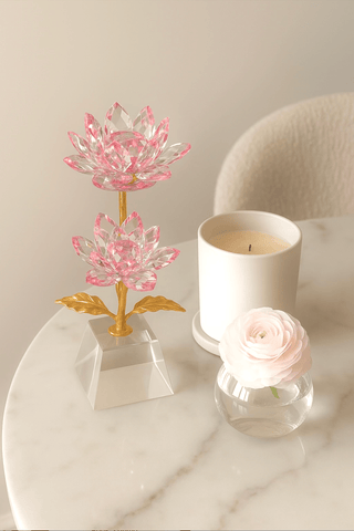 Crystal Golden Blossom in Blush Pink atop a luxurious, cozy marble dining table.