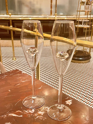 ‘100-Carat’ Diamond Champagne Flute Set of 2 in a gold-adorned Parisian restaurant.