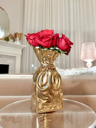 Giovanna Golden Bag Vase decorated with red florals.