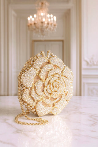 A side view of the sparkling features of the Rosette d’Or Mini Clutch with detachable gold chain.