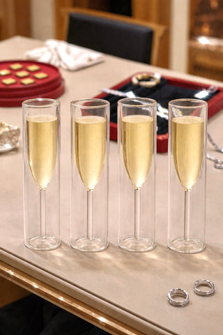 Maeve Double Layered Glass Cups filled with alcohol, showcasing insulated glass walls.