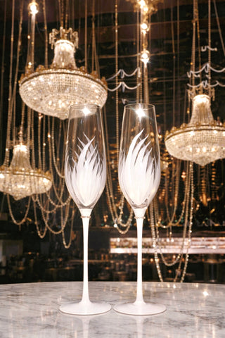 A bar uses the Feather Bliss Champagne Flutes to serve alcoholic beverages.