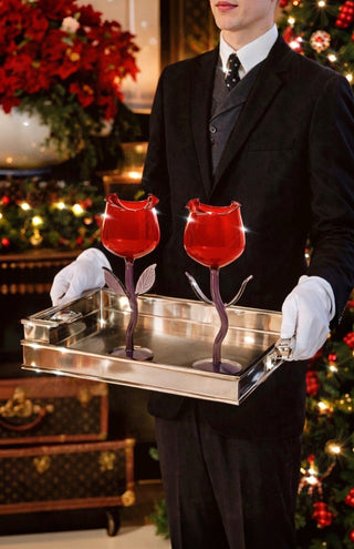 A server serves the Rose For Rosé Glass Cup in Red Set of 2 on a silver platter.