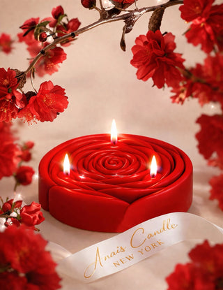 3-Wick Brilliant Rose Candle in Red photoshoot with lush red florals and silk