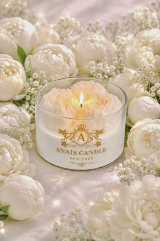 Peony Bouquet Candle in White on a marble dining table in a luxury penthouse