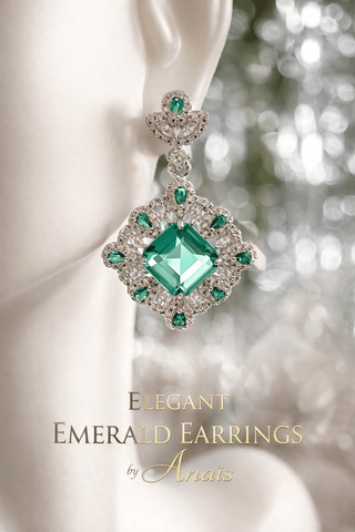 Elegant Emerald Earrings on a mannequin.