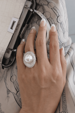 Naomi Pearl adjustable ring worn in a multi-million dollar mansion dinner