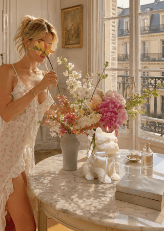 Charming White Terrier Puppy Candle on the dining table of a luxury condo