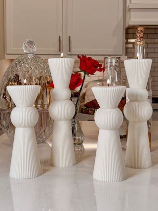 Two sets of the Enzo Pillar Candle in Sculpture White.