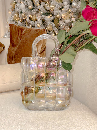 Camélia Padded Glass Handbag Vase in Rainbow with a decorated Christmas tree and luxury throw pillows.