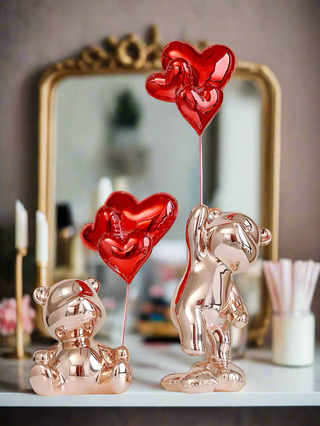 Fleeting Love Bears with Heart Balloon Sculpture Set of 2 - Extra Large on a white marble dresser.