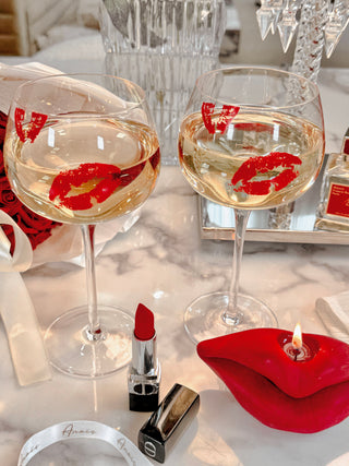 ‘Kiss Me, If You Adore Me’ Glass Cup Set surrounded by luxury goods.