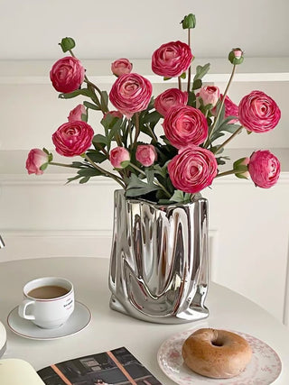 Luxe Bag Vase - Sliver Electroplated with a pink floral arrangement.