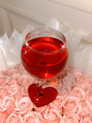 “My Valentine” Wine Glass Cup atop a lavish pink bouquet.