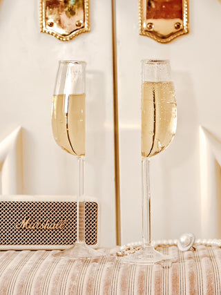 ‘We Are One’ Wine Glass Cup Set of 2 full of sparkling white champagne.