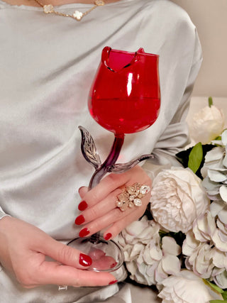 Rose For Rosé Glass Cup in Red - Handcrafted held by a model in both hands, next to bloomed spring flowers.