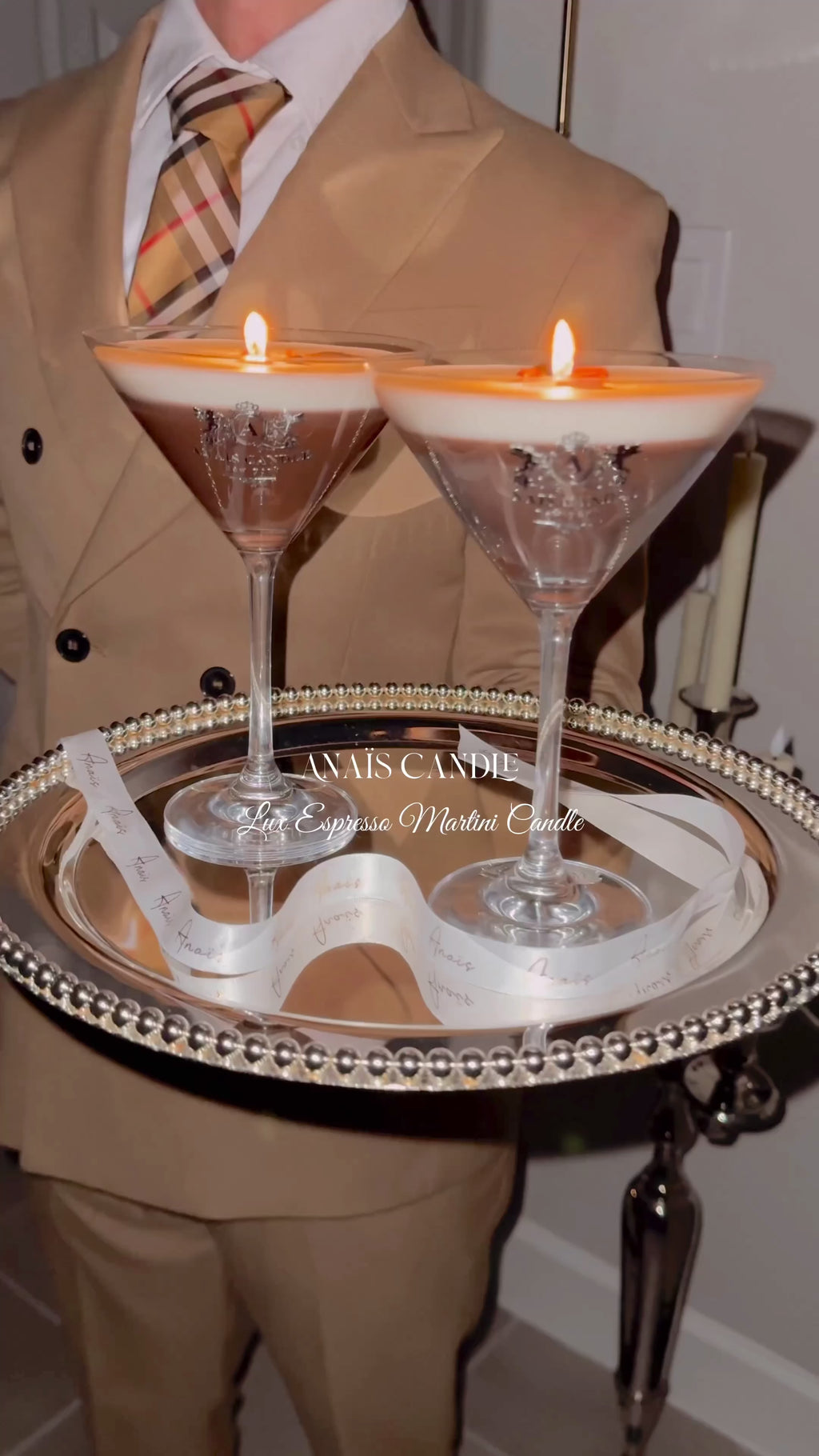 Two lit Lux Espresso Martini Candle atop a silver tray.