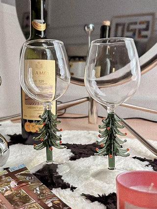 Christmas Tree Glass Cup - Handmade next to a bottle of red wine.