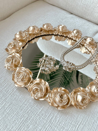 Golden Roses Mirror Tray with luxurious jewelry placed on top.