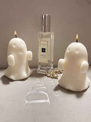 Two lit Mini Ghost Candles.